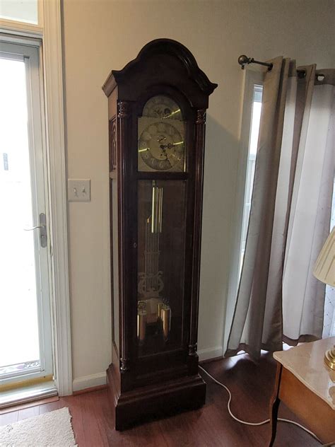 Size: Height 85 11/16", Width 25 1/2", Depth 14 5/8". . Vintage sligh grandfather clock